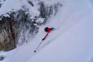 skiier skiing down mt